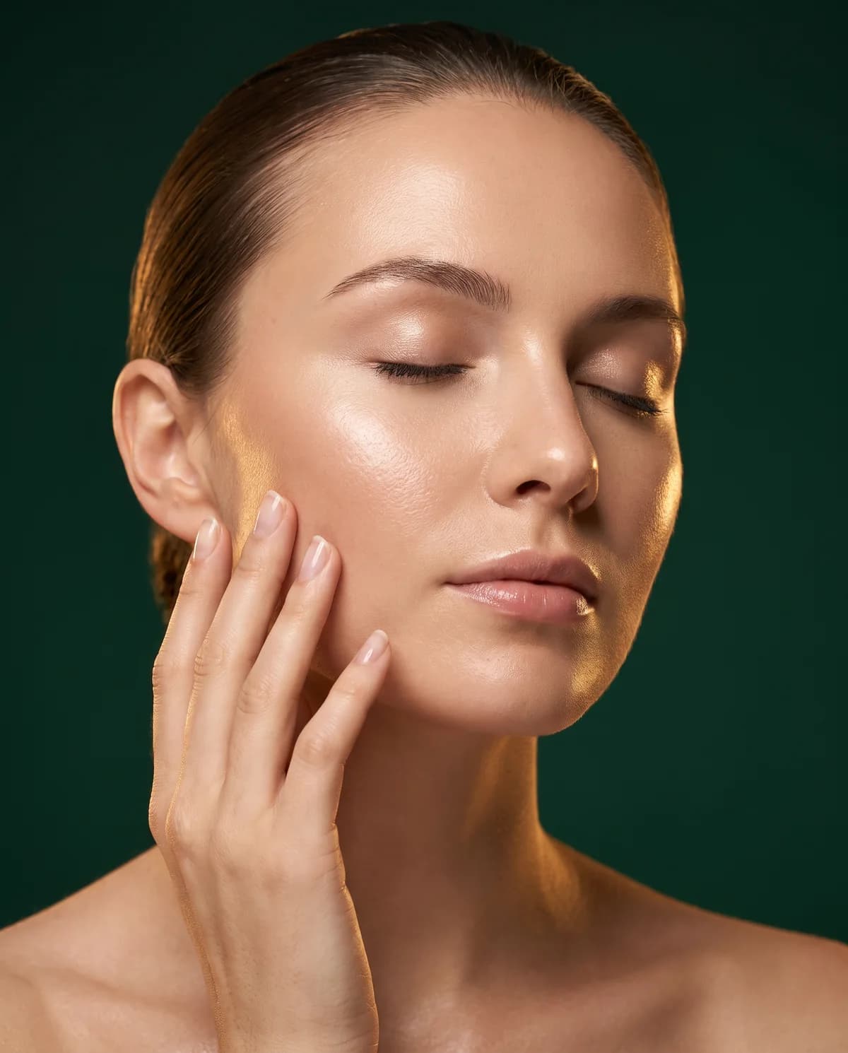 A woman with closed eyes, her hand resting on her cheek — illustrative image