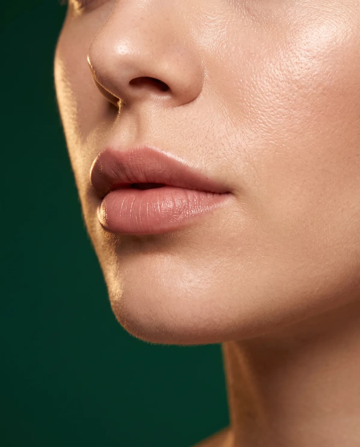 Close-up of lips and chin in warm golden light — illustrative image
